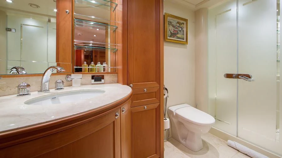 a bathroom with a sink toilet and a mirror aboard BENIK Yacht for Charter