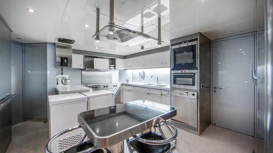 a kitchen with a sink and stove aboard BENIK Yacht for Charter