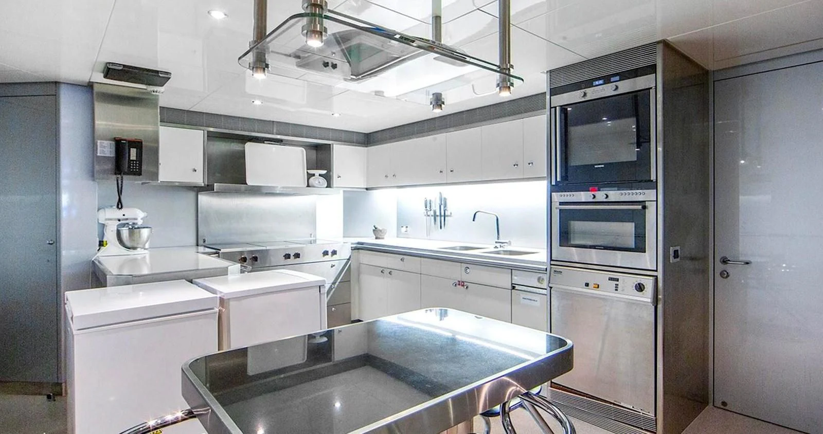 a kitchen with a sink and stove aboard BENIK Yacht for Charter