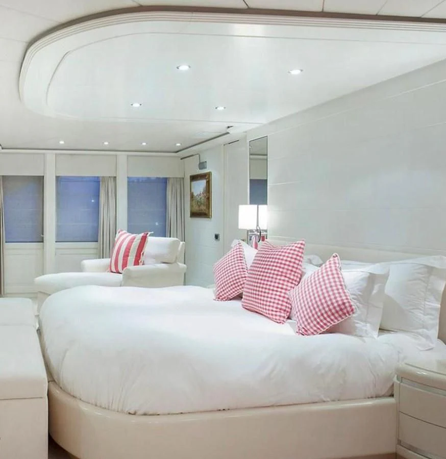 a white couch with pillows aboard BENIK Yacht for Charter