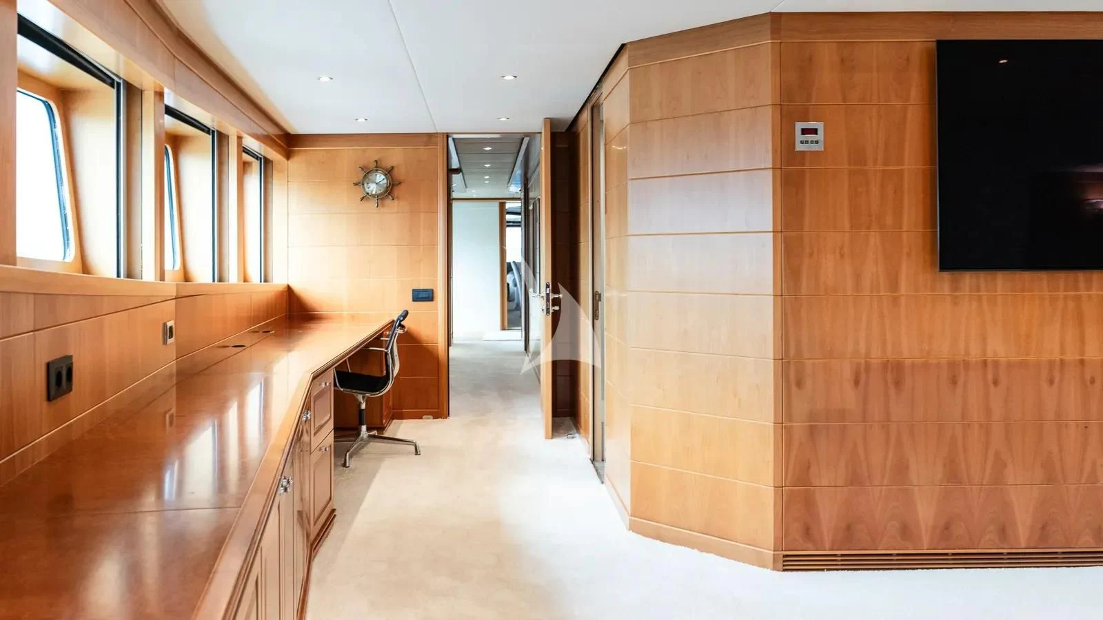 a long hallway with a desk and chairs aboard BENIK Yacht for Charter