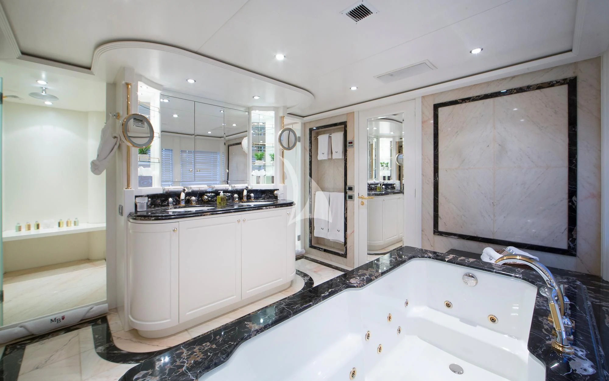 a large bathroom with a large jacuzzi tub aboard BENIK Yacht for Charter