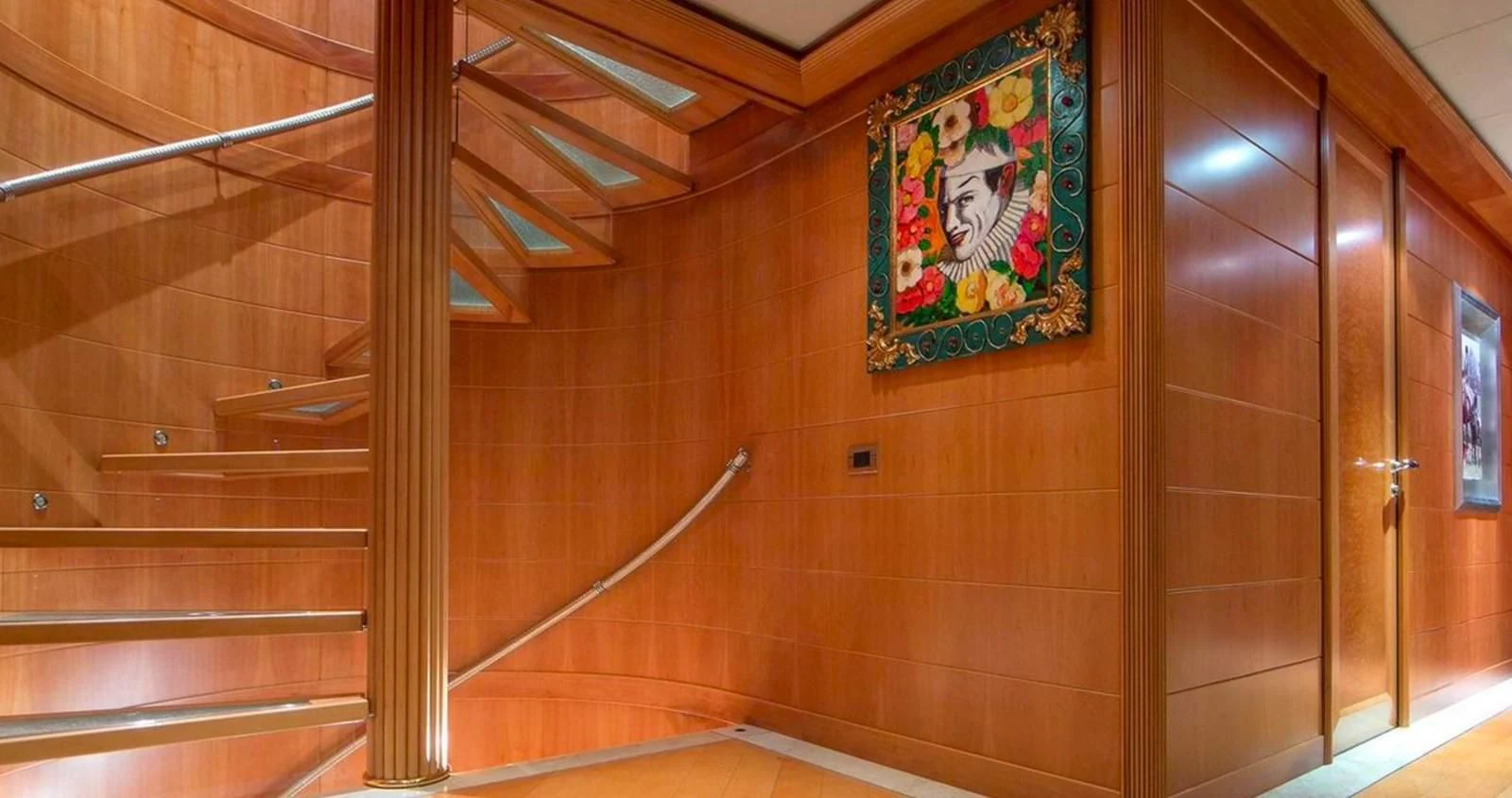 a room with a painting on the wall aboard BENIK Yacht for Charter