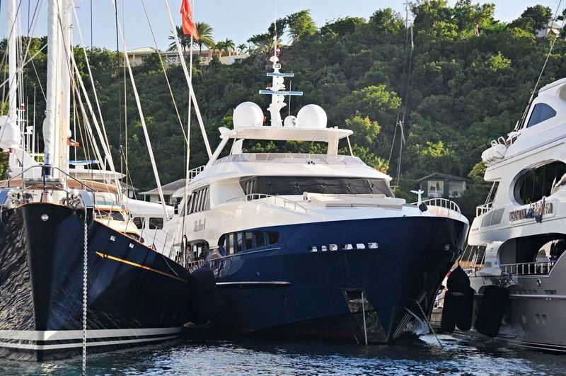 several boats docked at a pier aboard BENIK Yacht for Charter