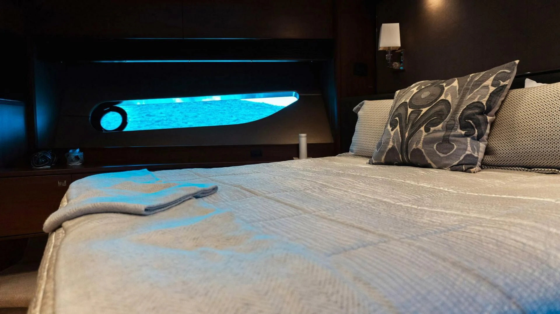 a bed with a television on the wall aboard MOIRA CINCO Yacht for Sale