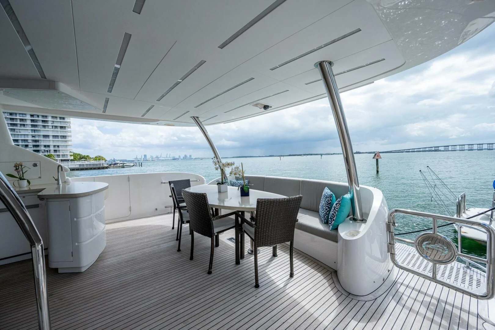 a table and chairs on a deck aboard MOIRA CINCO Yacht for Sale