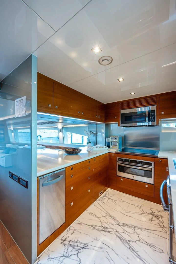 a kitchen with a large island aboard MOIRA CINCO Yacht for Sale