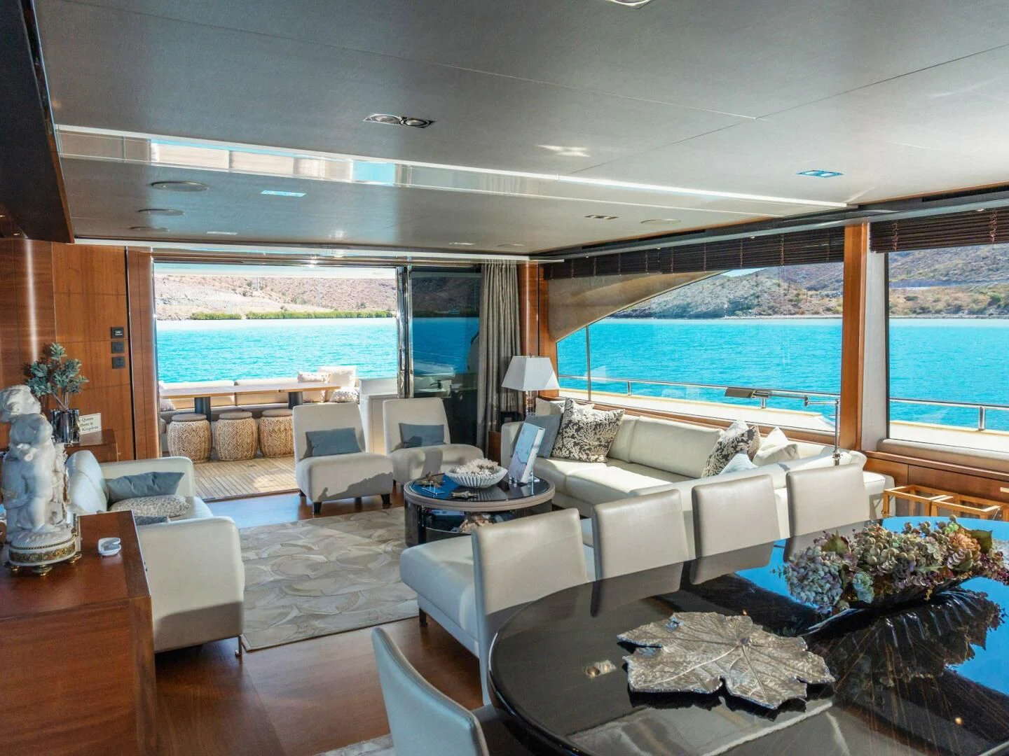 a living room with a large window aboard MOIRA CINCO Yacht for Sale