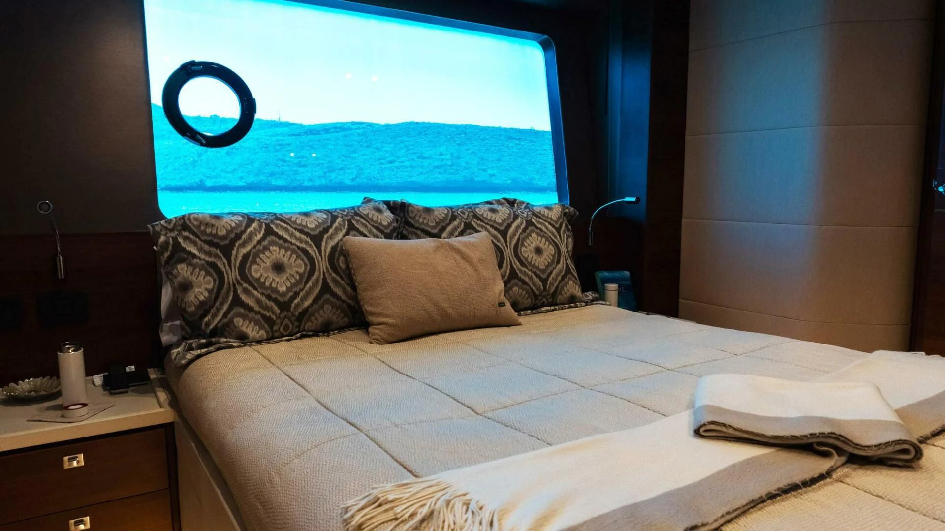 a bed with a large screen aboard MOIRA CINCO Yacht for Sale