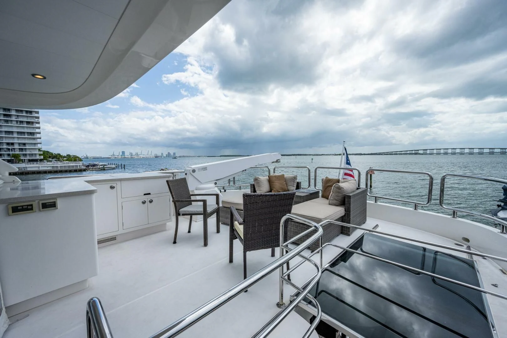 a deck with chairs and tables on it aboard MOIRA CINCO Yacht for Sale