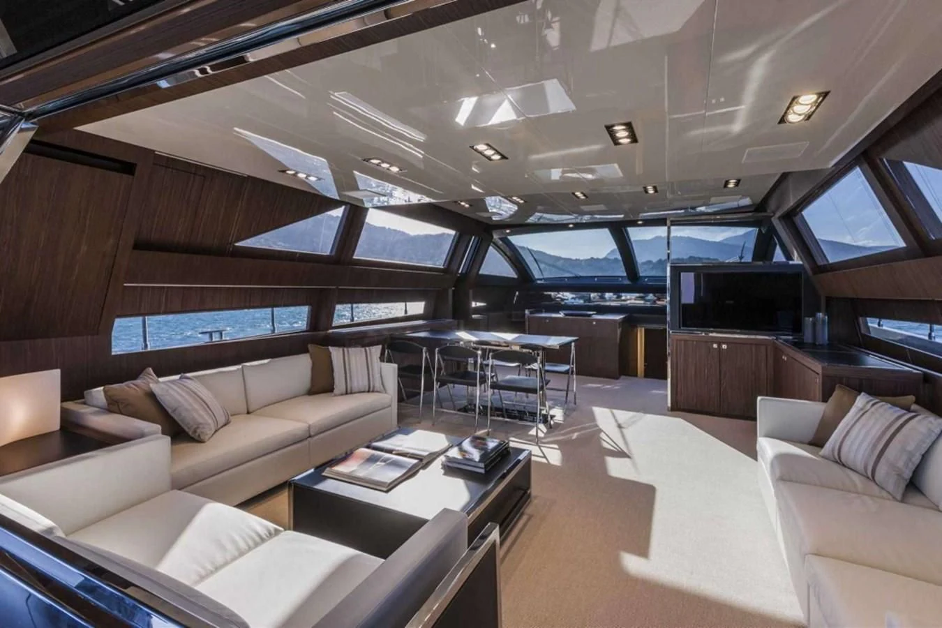 a room with a couch and a table aboard MOIRA CINCO Yacht for Sale