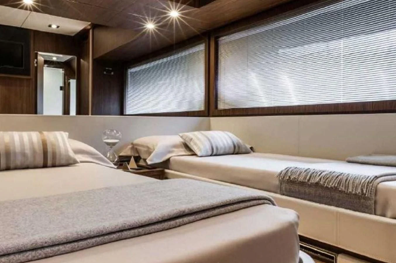 a room with a couple of beds aboard MOIRA CINCO Yacht for Sale