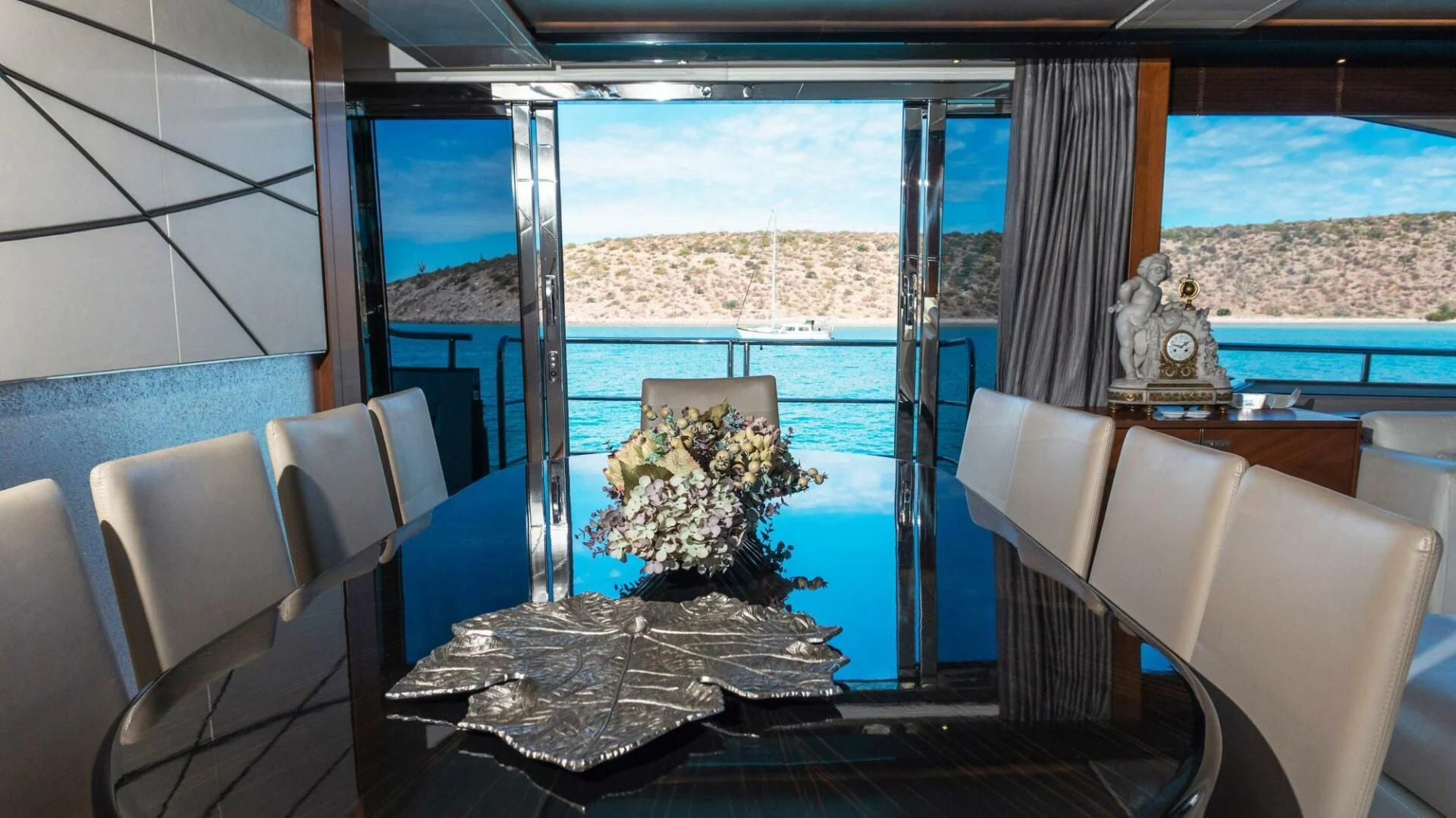 a room with a table and chairs aboard MOIRA CINCO Yacht for Sale