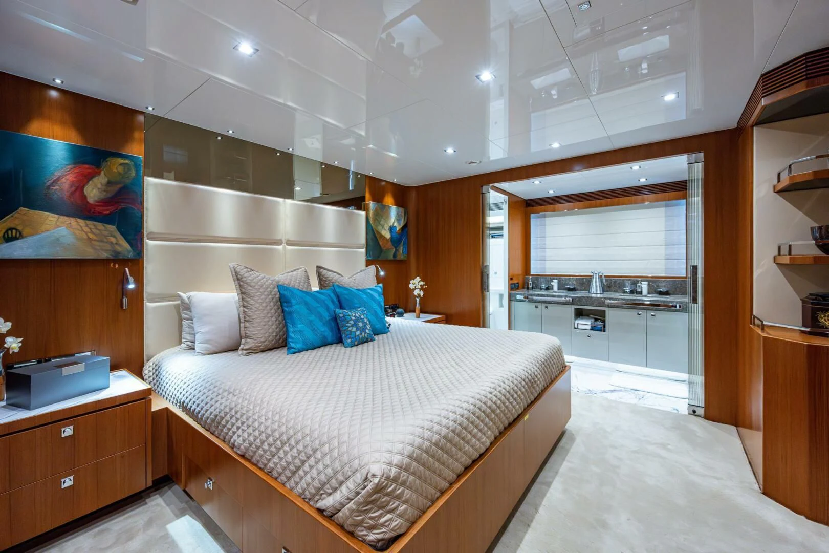 a bedroom with a bed and a desk aboard MOIRA CINCO Yacht for Sale