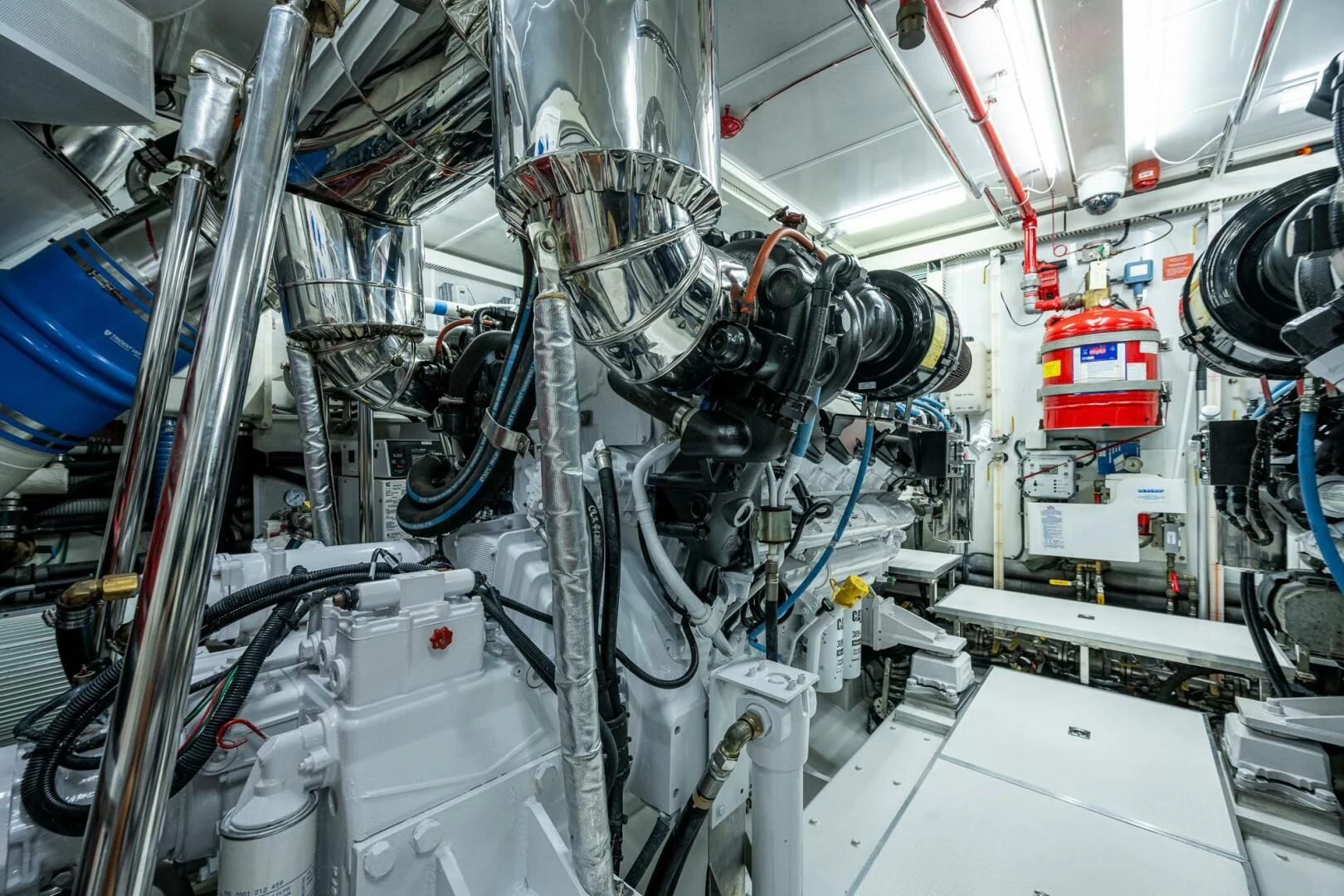 a room with several pipes and wires aboard MOIRA CINCO Yacht for Sale