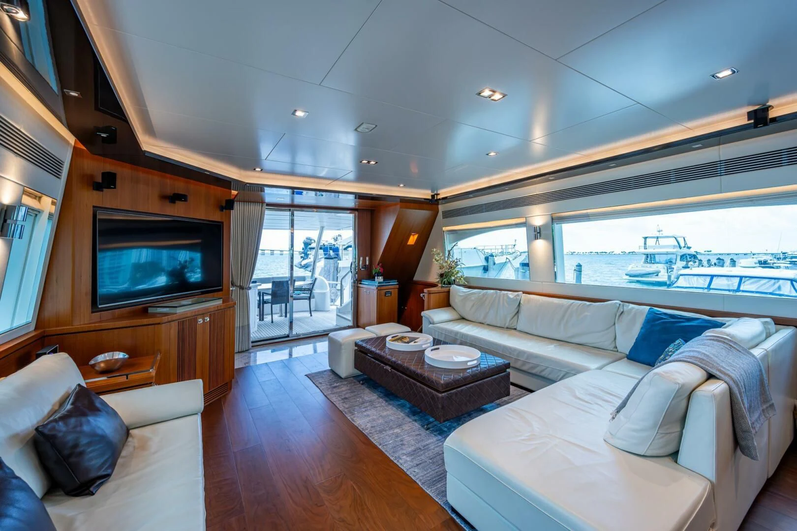 a living room with a large window aboard MOIRA CINCO Yacht for Sale