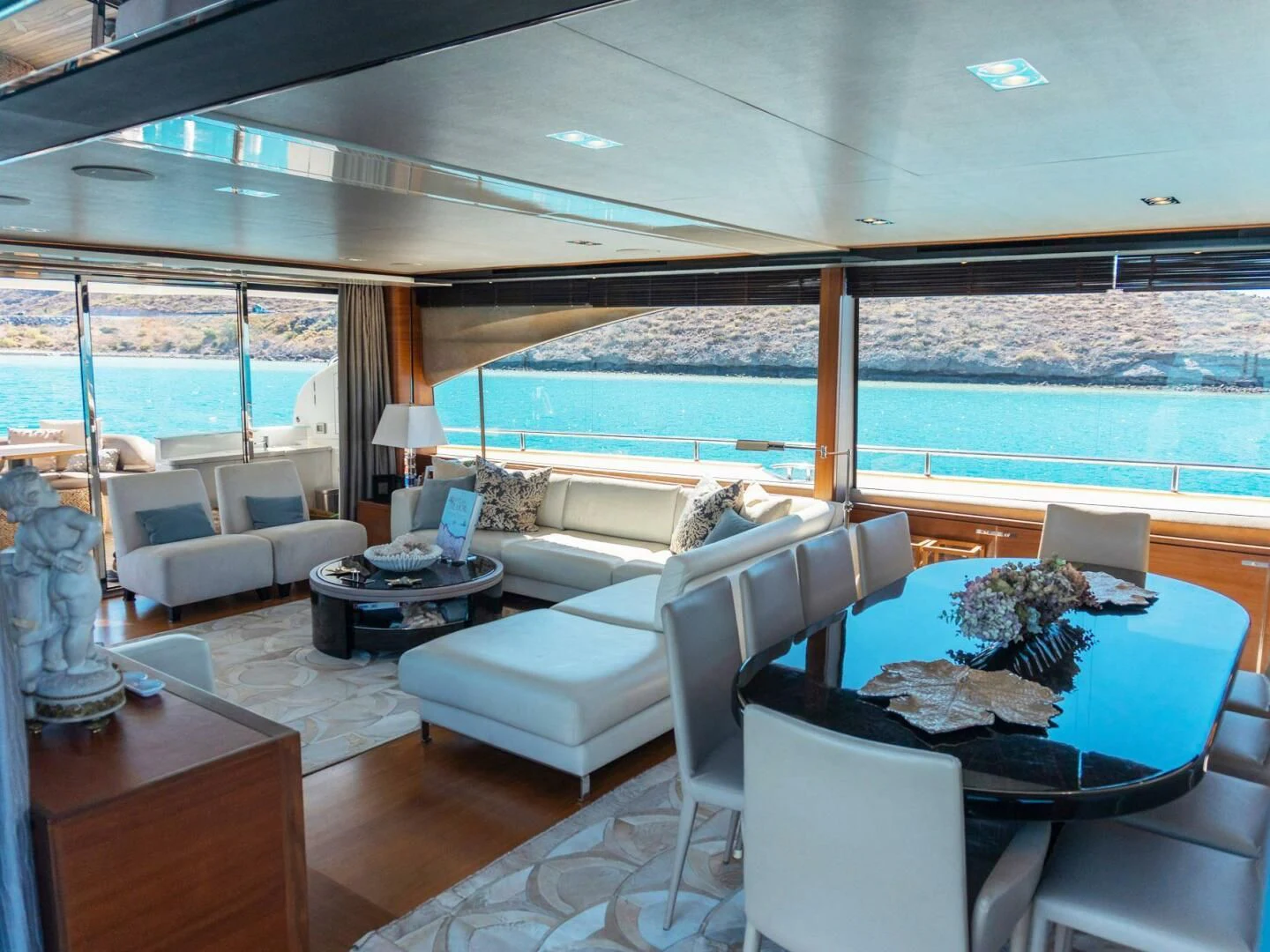 a living room with a large glass window aboard MOIRA CINCO Yacht for Sale