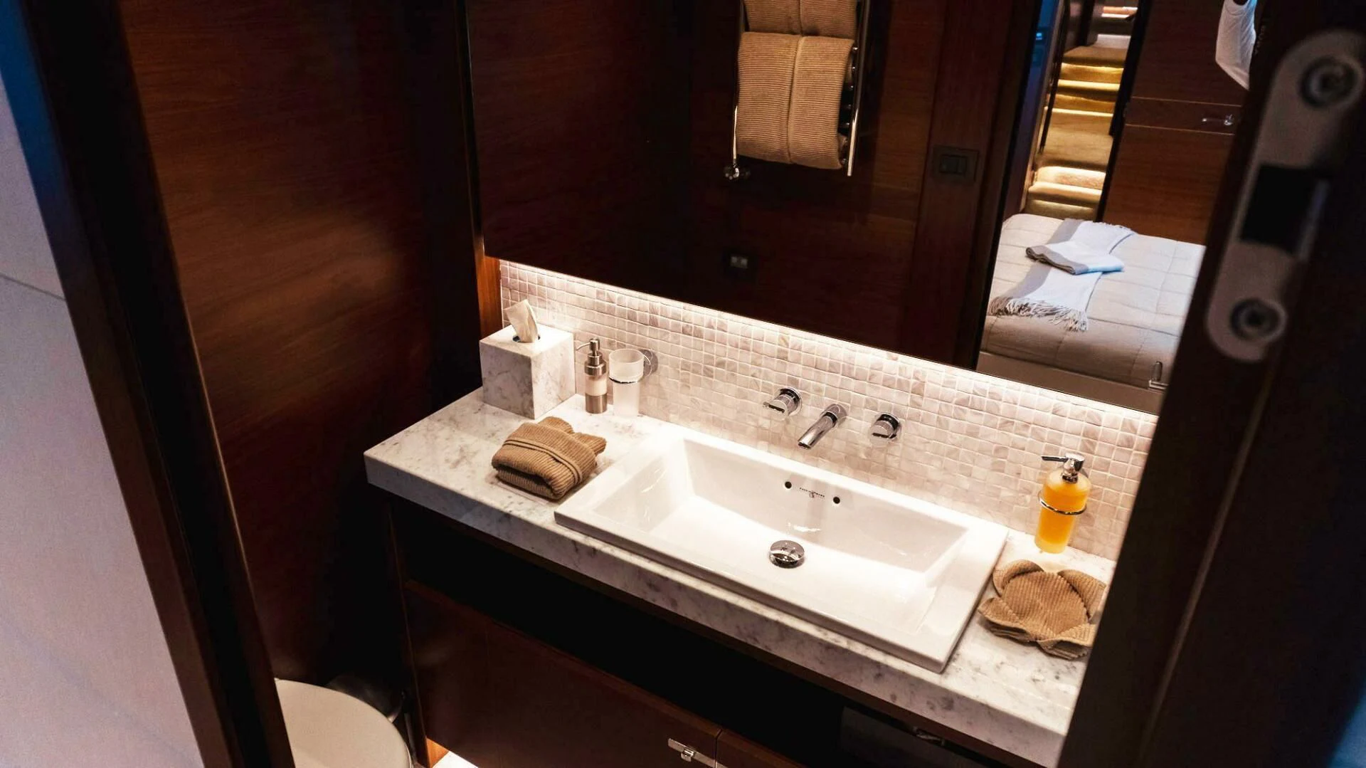 a bathroom with a sink and a mirror aboard MOIRA CINCO Yacht for Sale