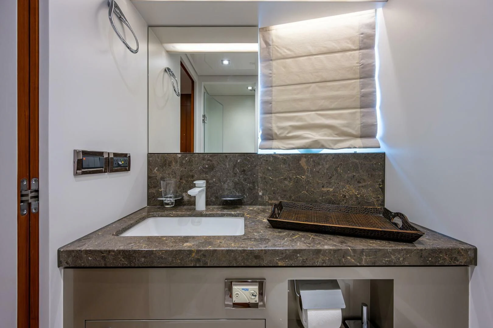a bathroom with a marble countertop aboard MOIRA CINCO Yacht for Sale