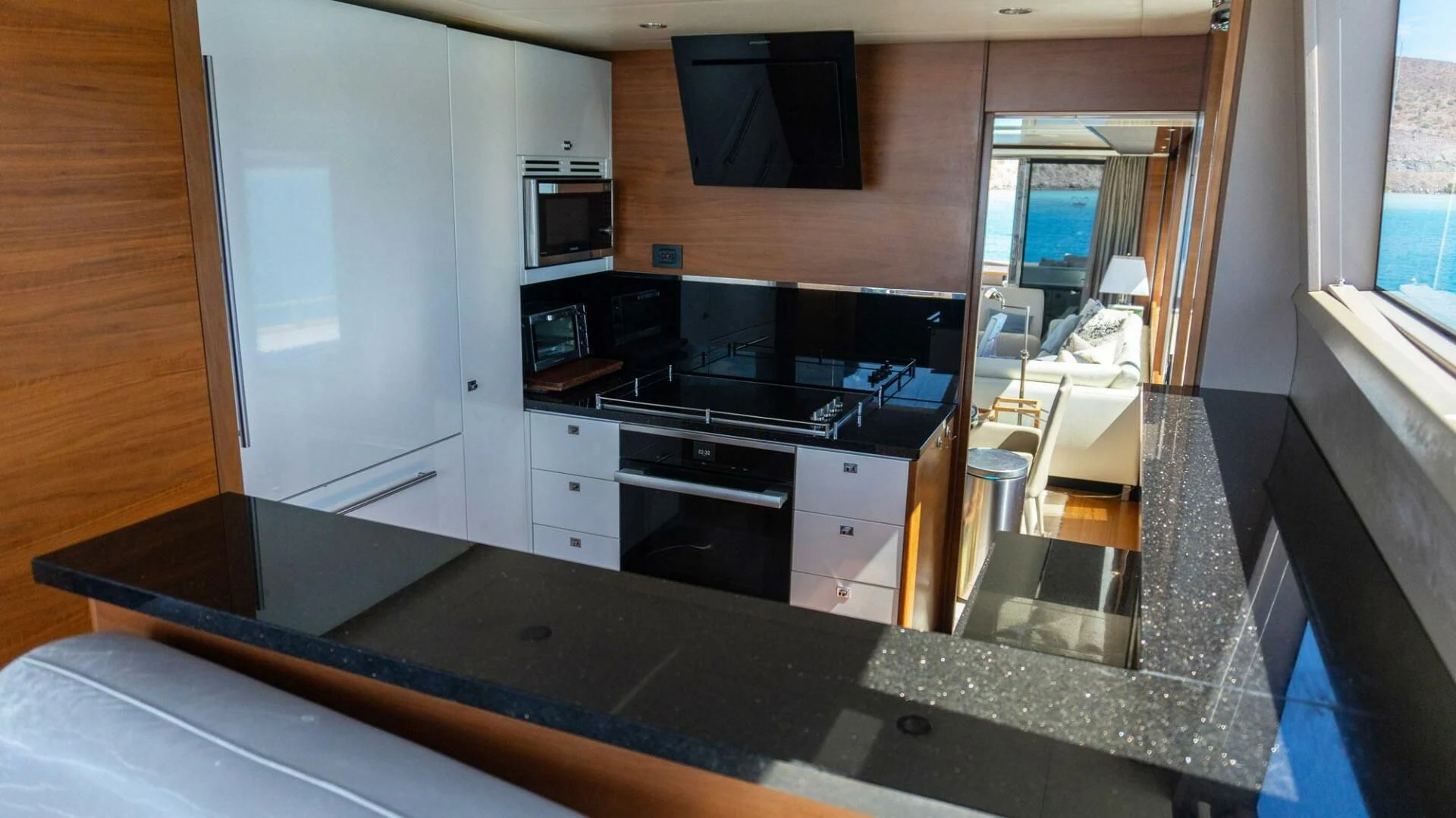 a kitchen with a large island aboard MOIRA CINCO Yacht for Sale