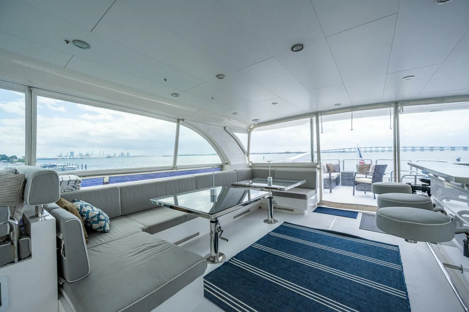 inside of a large room with a large window and a view of the ocean aboard MOIRA CINCO Yacht for Sale