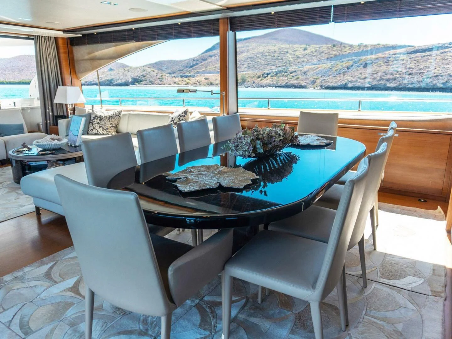 a table and chairs on a patio aboard MOIRA CINCO Yacht for Sale