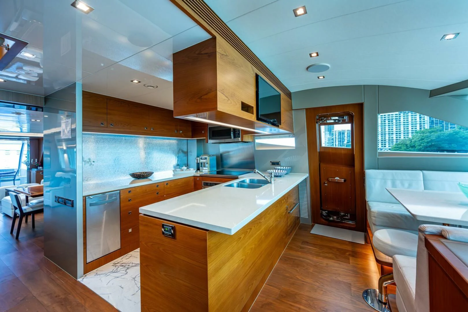 a kitchen with wooden cabinets aboard MOIRA CINCO Yacht for Sale