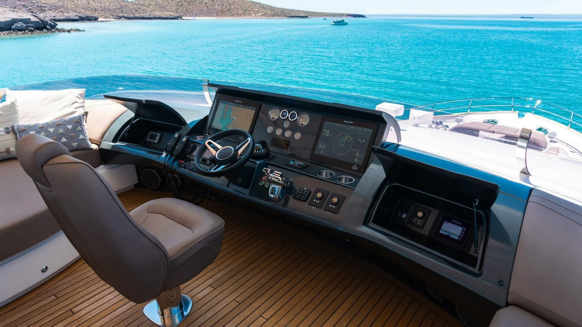 a person's hand holding a remote control on a boat aboard MOIRA CINCO Yacht for Sale