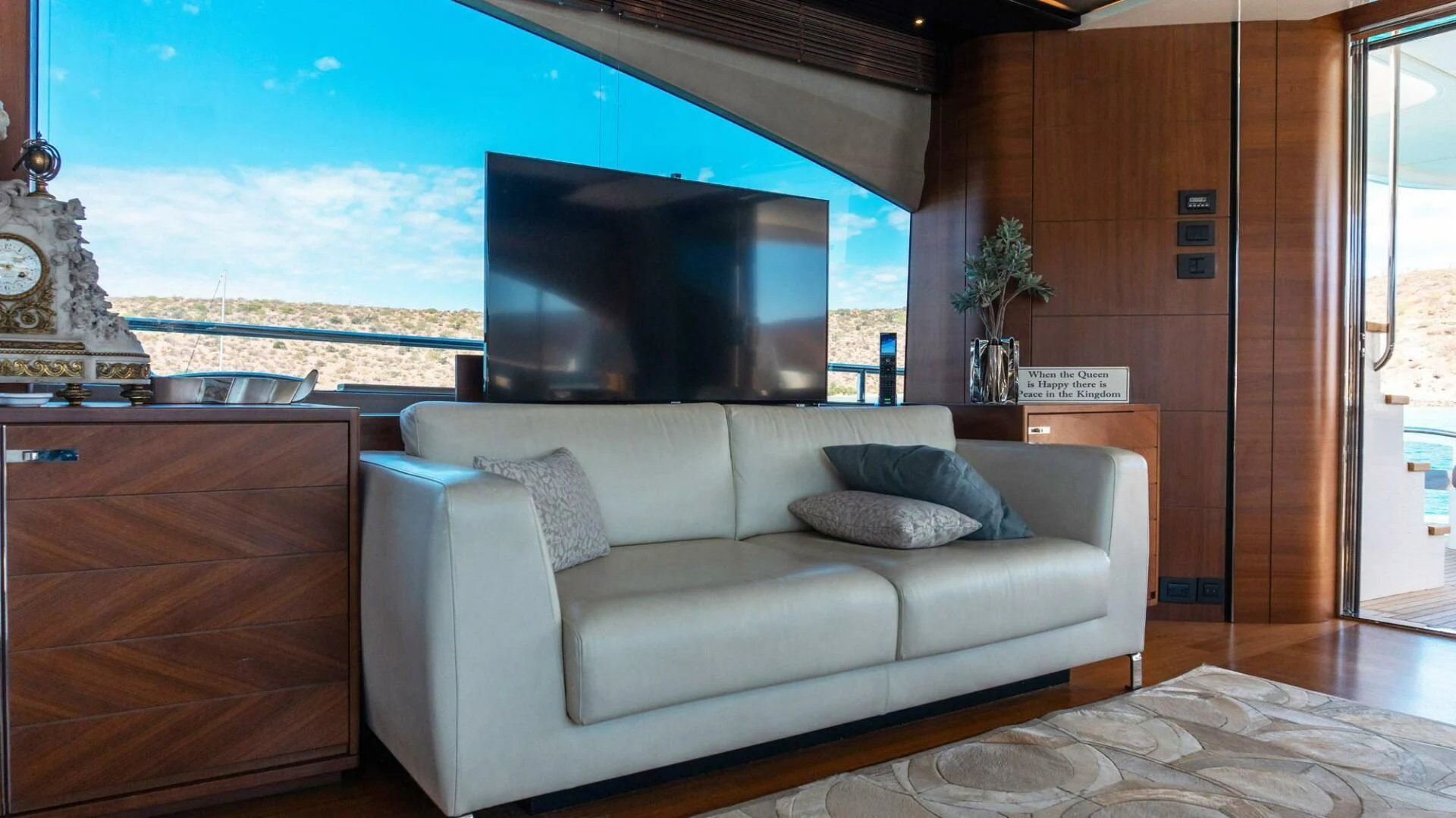 a living room with a large tv aboard MOIRA CINCO Yacht for Sale