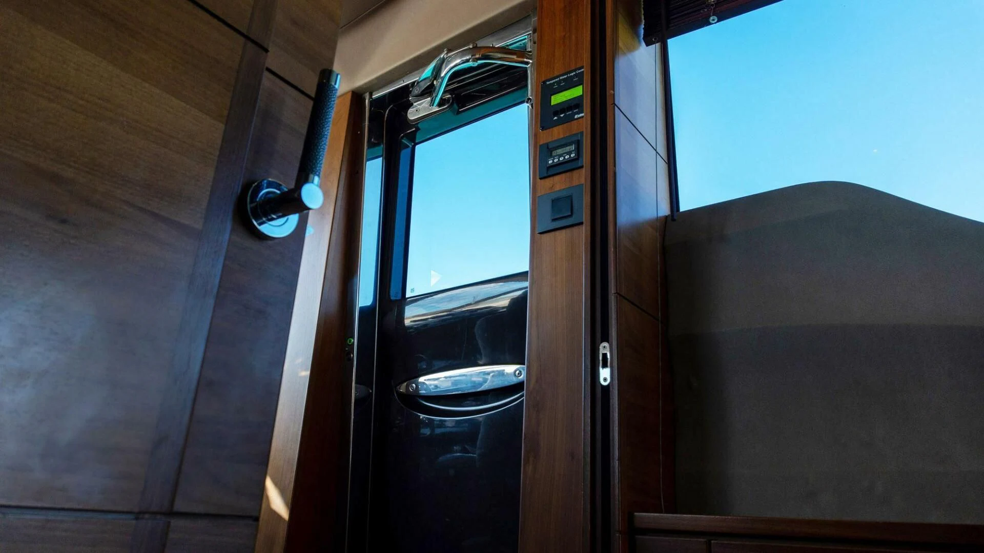 a door open to a room with a toilet in it aboard MOIRA CINCO Yacht for Sale