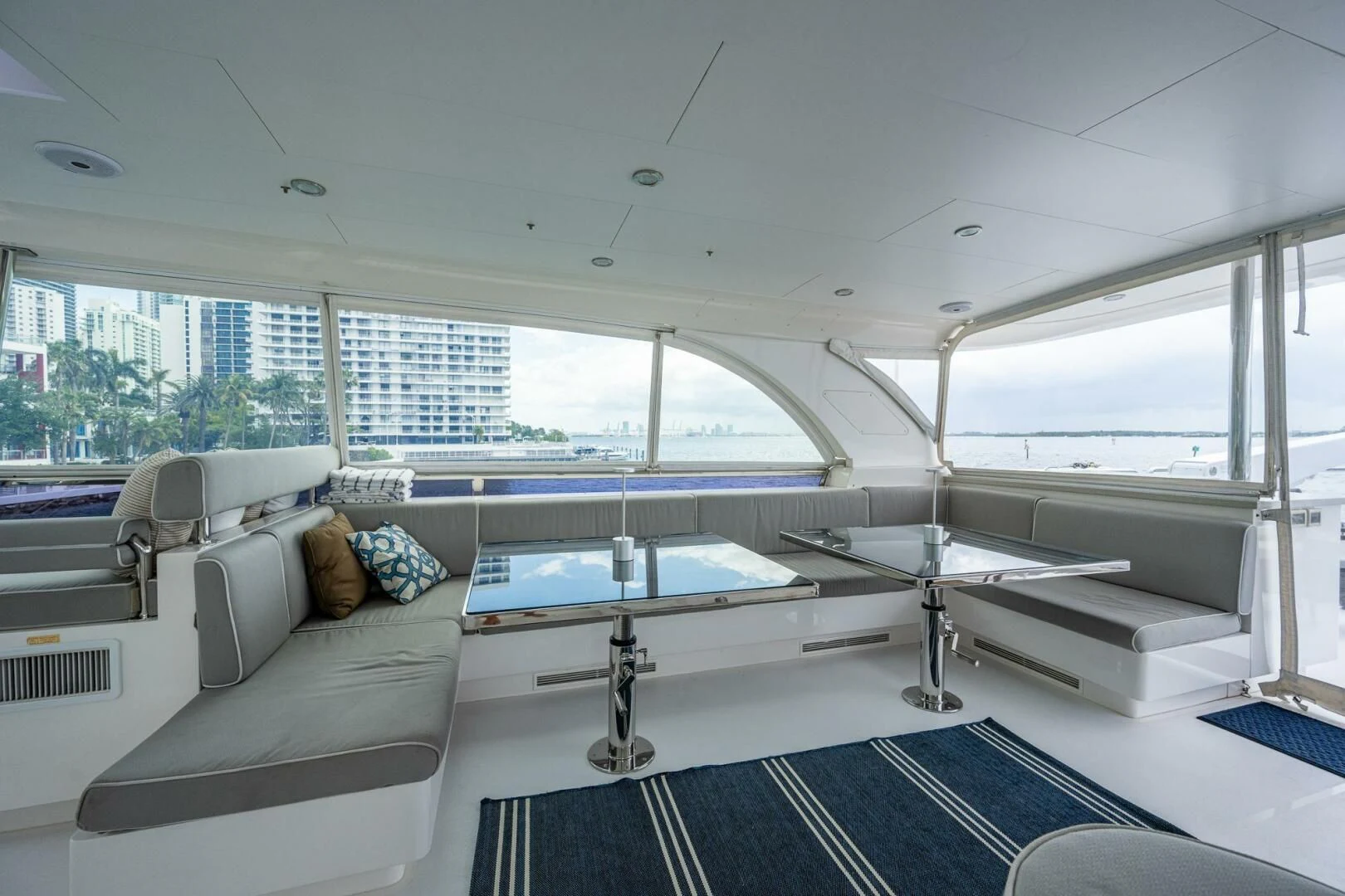 a room with a bed and a table aboard MOIRA CINCO Yacht for Sale
