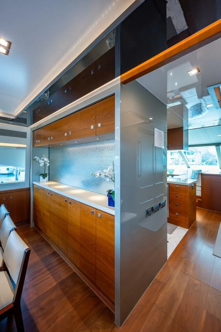 a kitchen with wooden cabinets aboard MOIRA CINCO Yacht for Sale