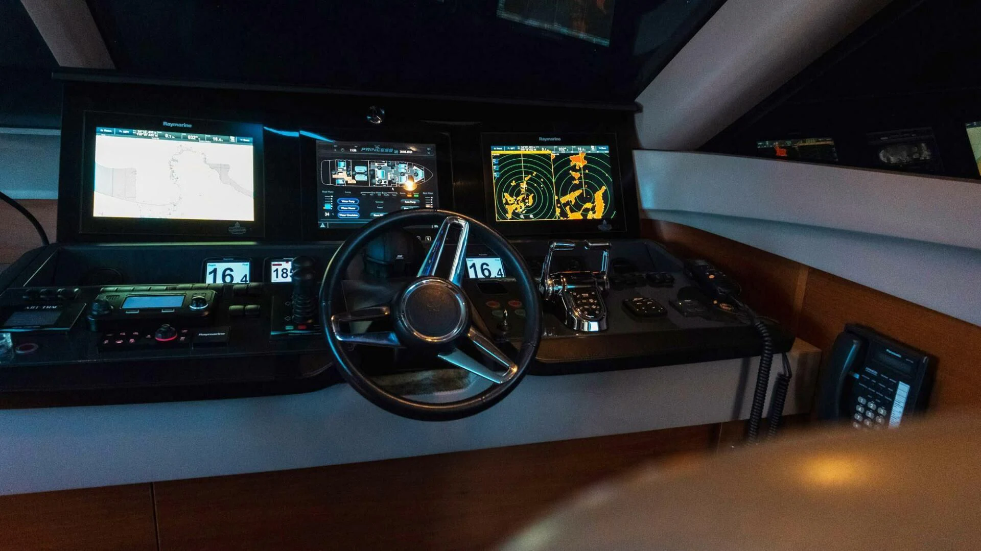 a steering wheel in a car aboard MOIRA CINCO Yacht for Sale