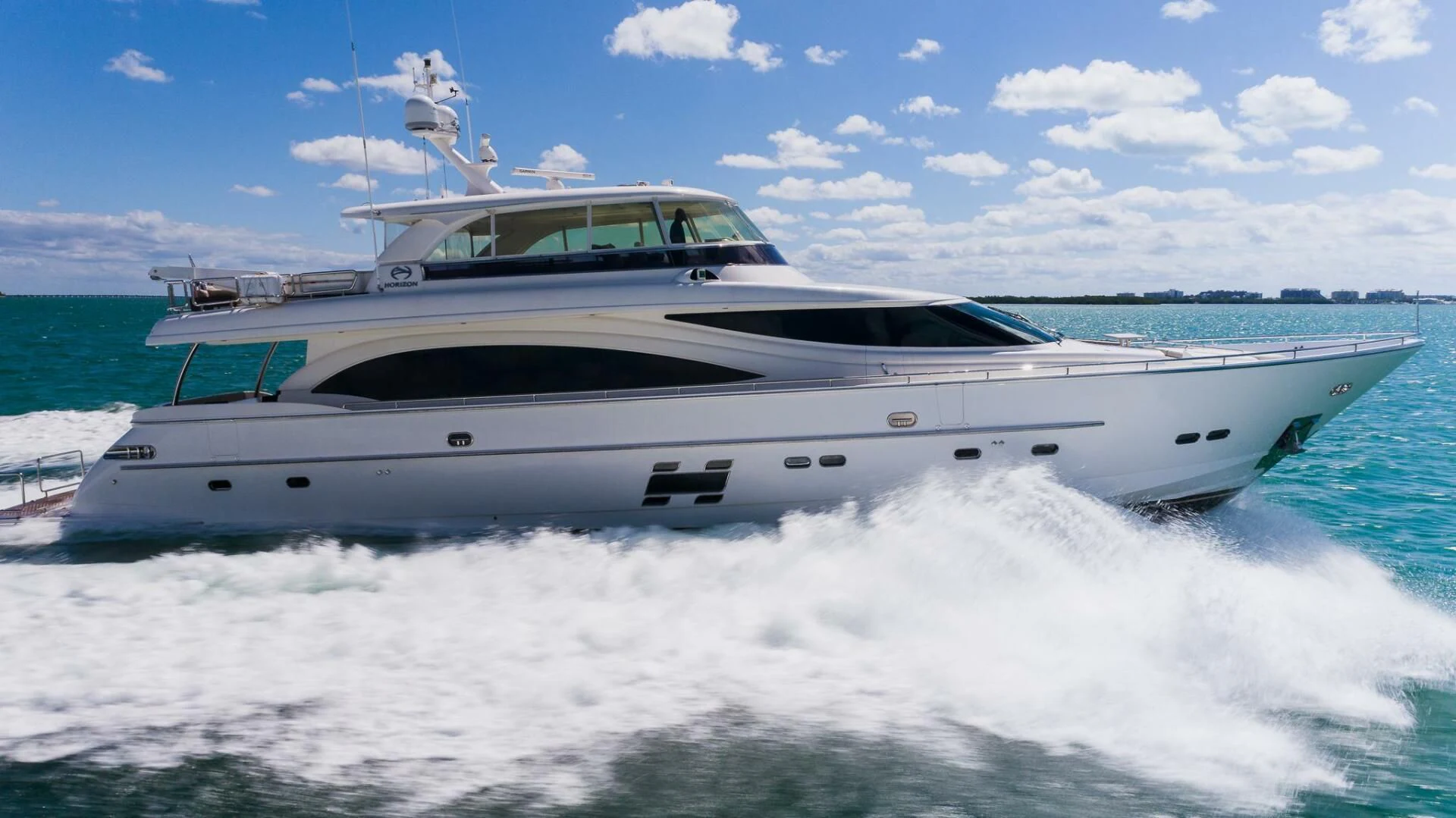 a white yacht on a body of water aboard MOIRA CINCO Yacht for Sale