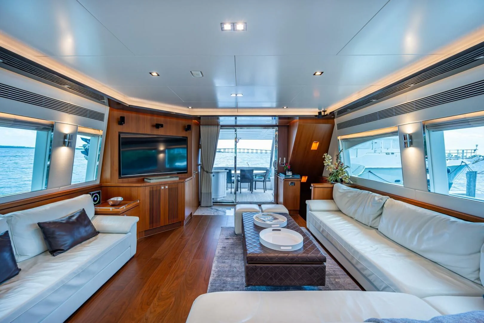 a living room with a large window aboard MOIRA CINCO Yacht for Sale