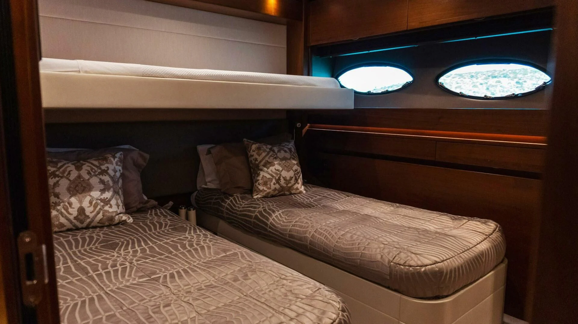 a bed with a couple of pillows aboard MOIRA CINCO Yacht for Sale