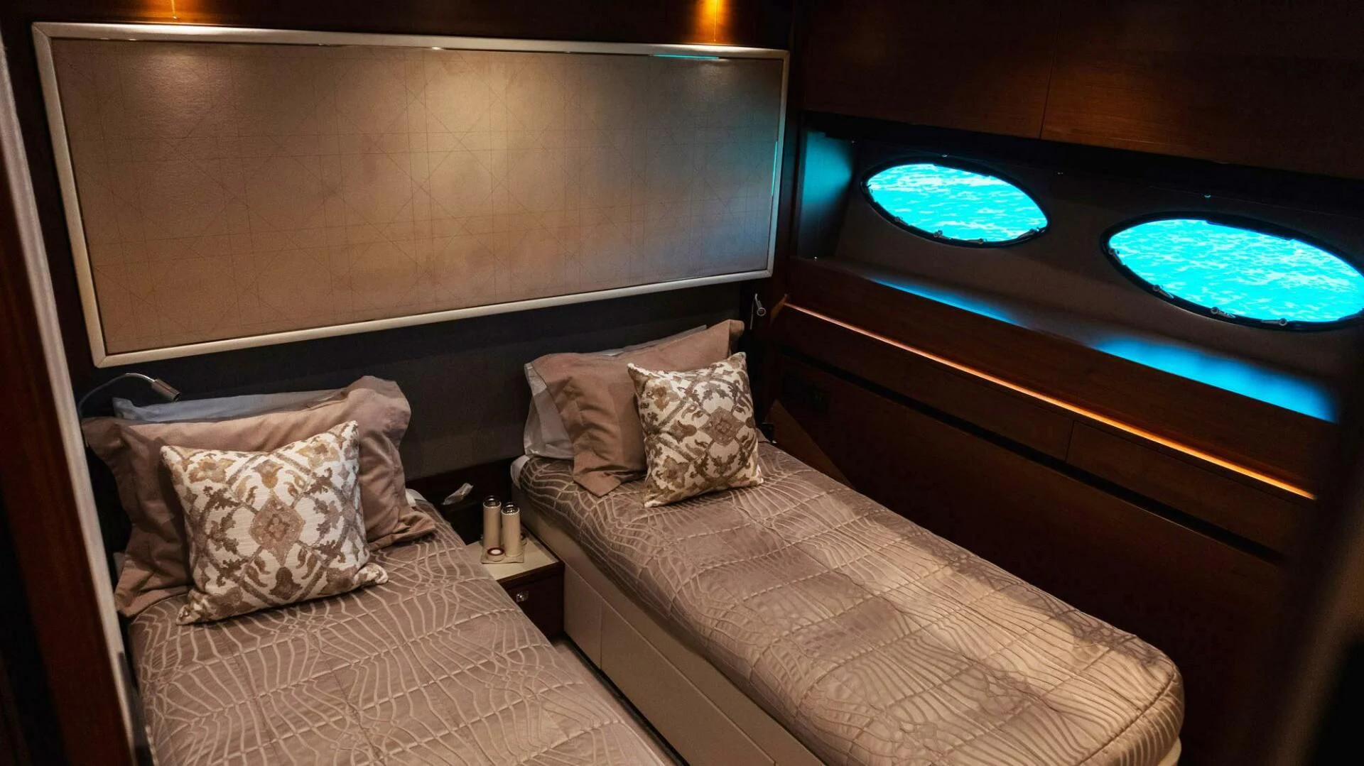 a bed with pillows and a television aboard MOIRA CINCO Yacht for Sale