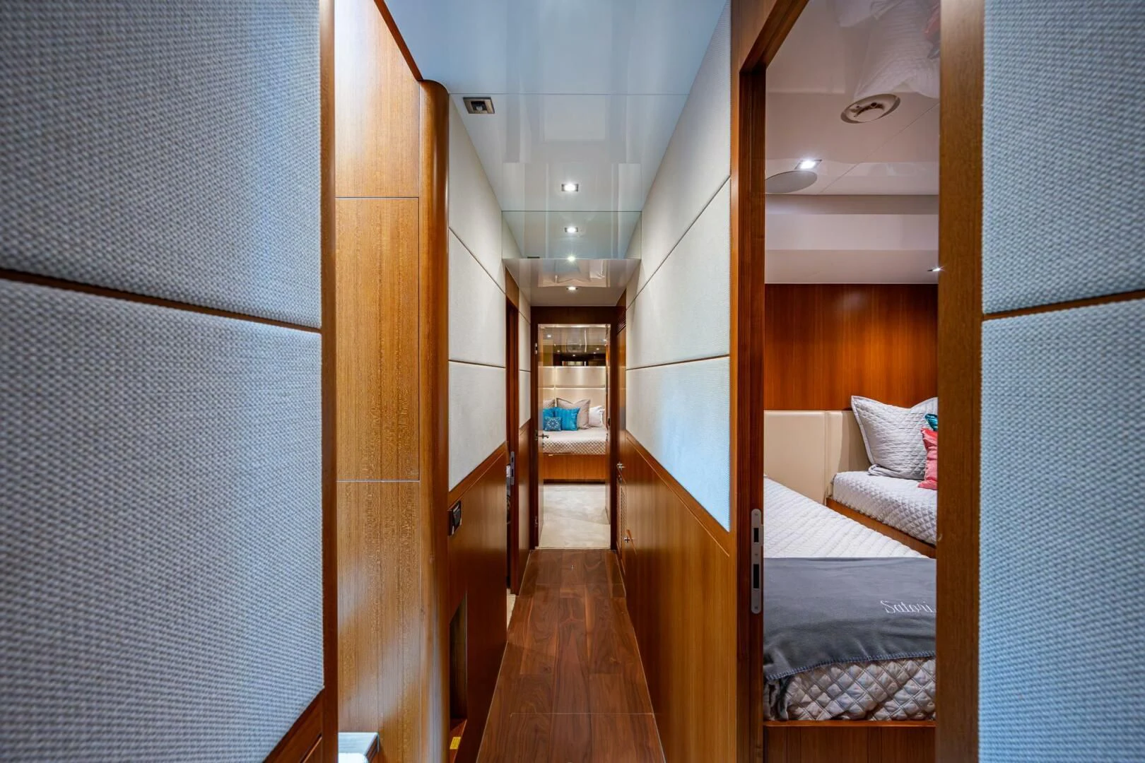 a room with a bed and a table aboard MOIRA CINCO Yacht for Sale