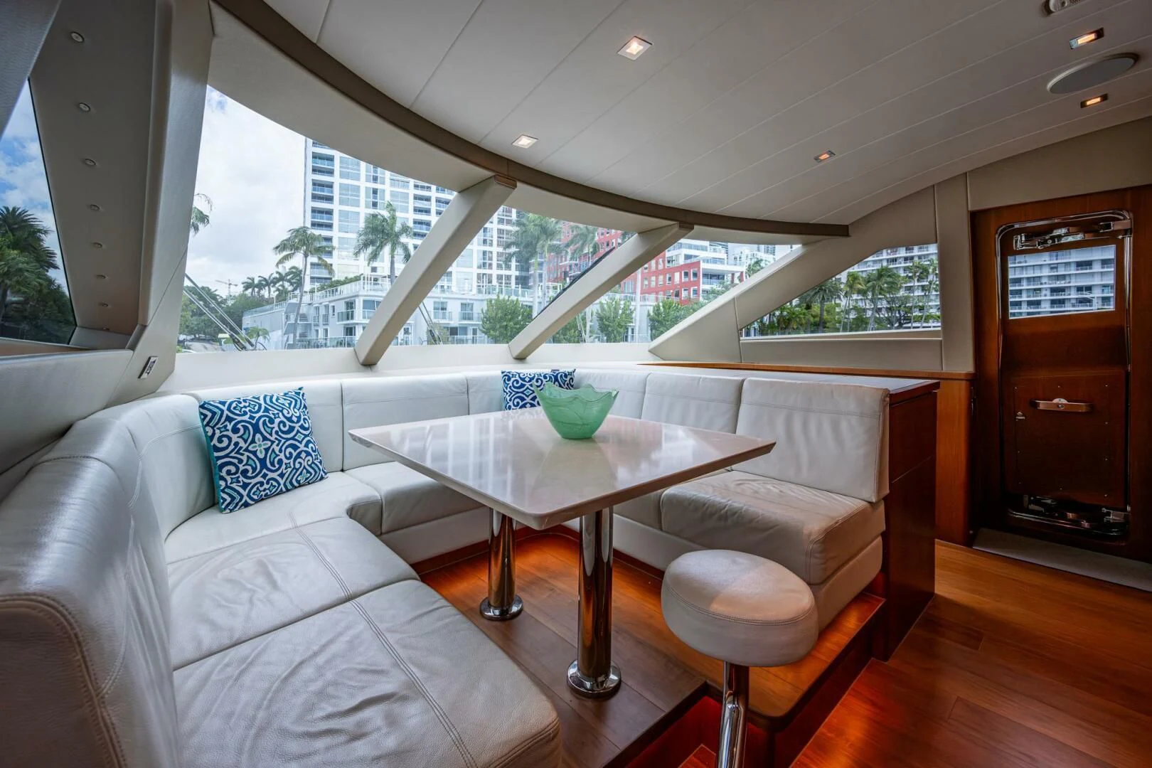 a living room with a table and chairs aboard MOIRA CINCO Yacht for Sale