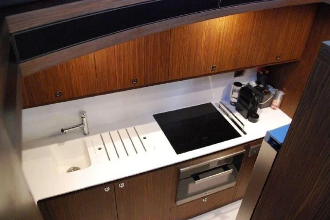 a kitchen with a black stove aboard MOIRA CINCO Yacht for Sale