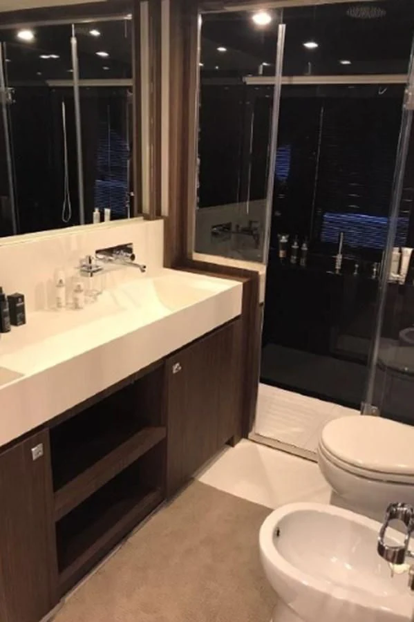 a bathroom with a sink and a mirror aboard MOIRA CINCO Yacht for Sale