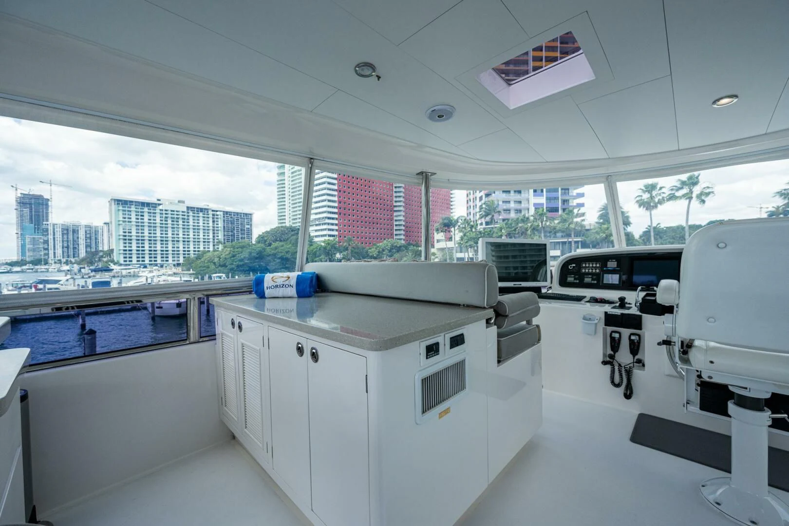a room with a large window and a desk with a computer on it aboard MOIRA CINCO Yacht for Sale