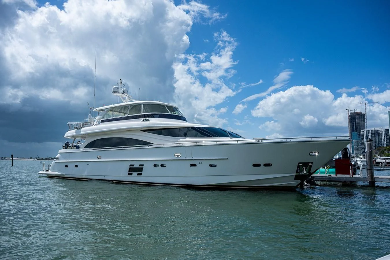 a white yacht docked at a dock aboard MOIRA CINCO Yacht for Sale
