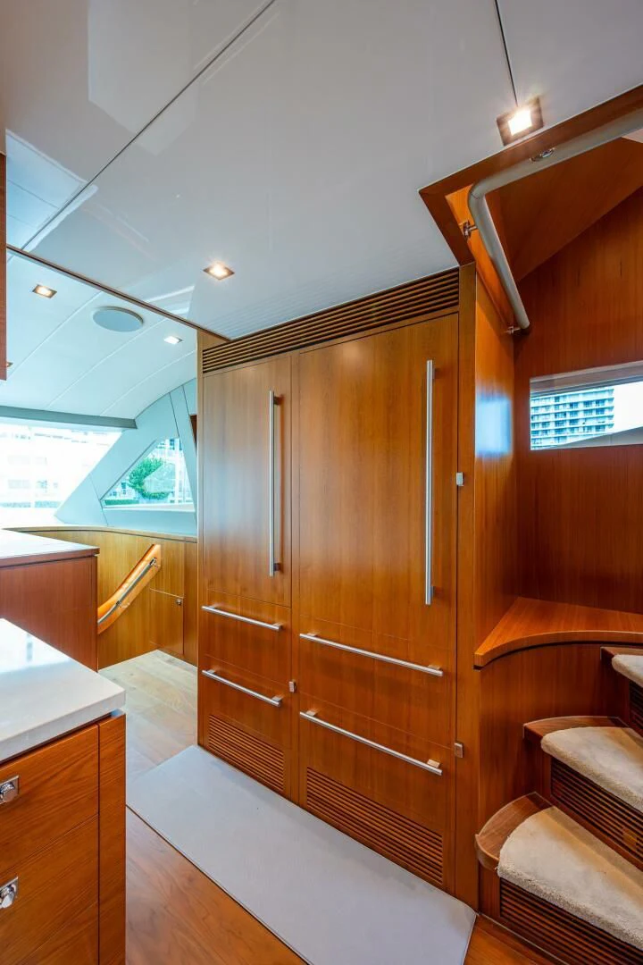 a wooden cabinet in a room aboard MOIRA CINCO Yacht for Sale