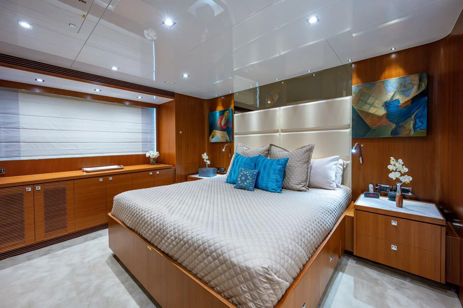 a bedroom with a bed and a desk aboard MOIRA CINCO Yacht for Sale