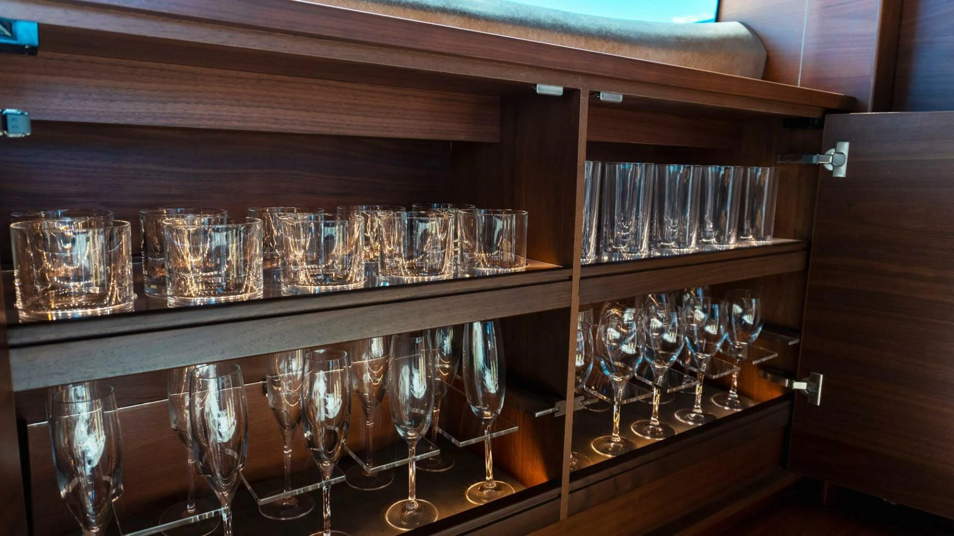 a group of wine glasses on a shelf aboard MOIRA CINCO Yacht for Sale