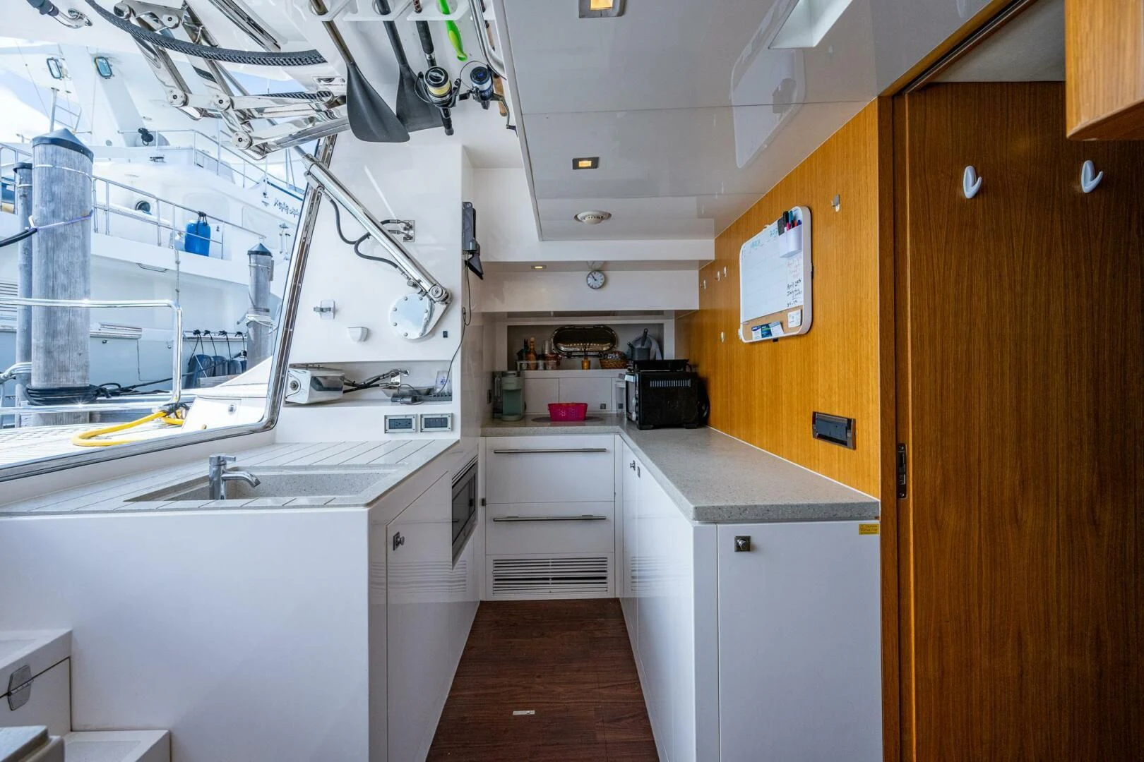 a kitchen with white cabinets aboard MOIRA CINCO Yacht for Sale