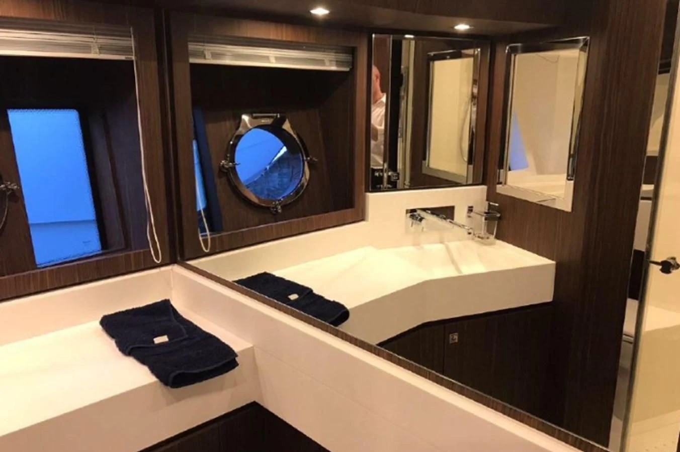 a bathroom with a large mirror aboard MOIRA CINCO Yacht for Sale