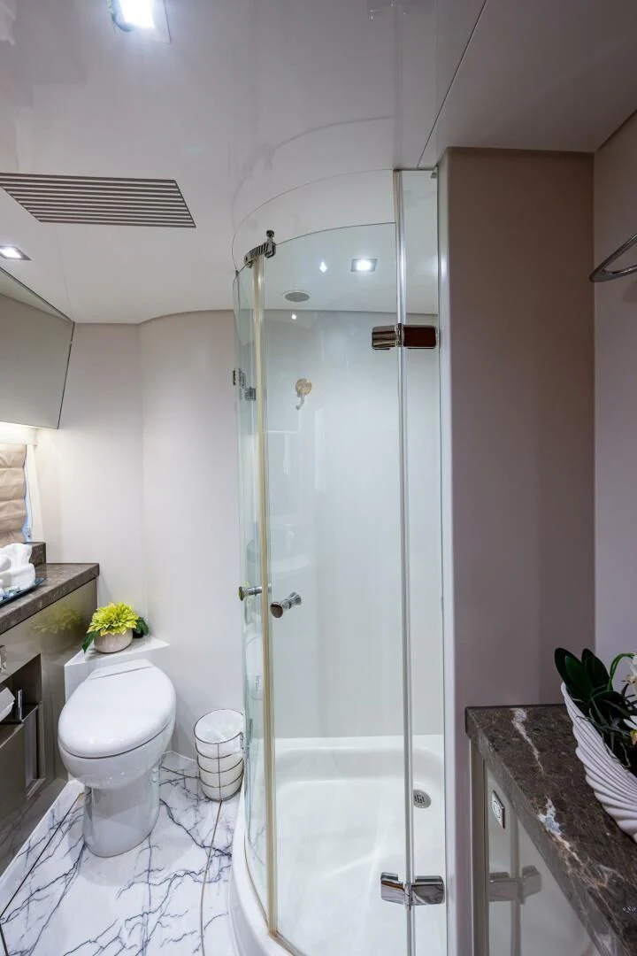 a bathroom with a glass shower aboard MOIRA CINCO Yacht for Sale