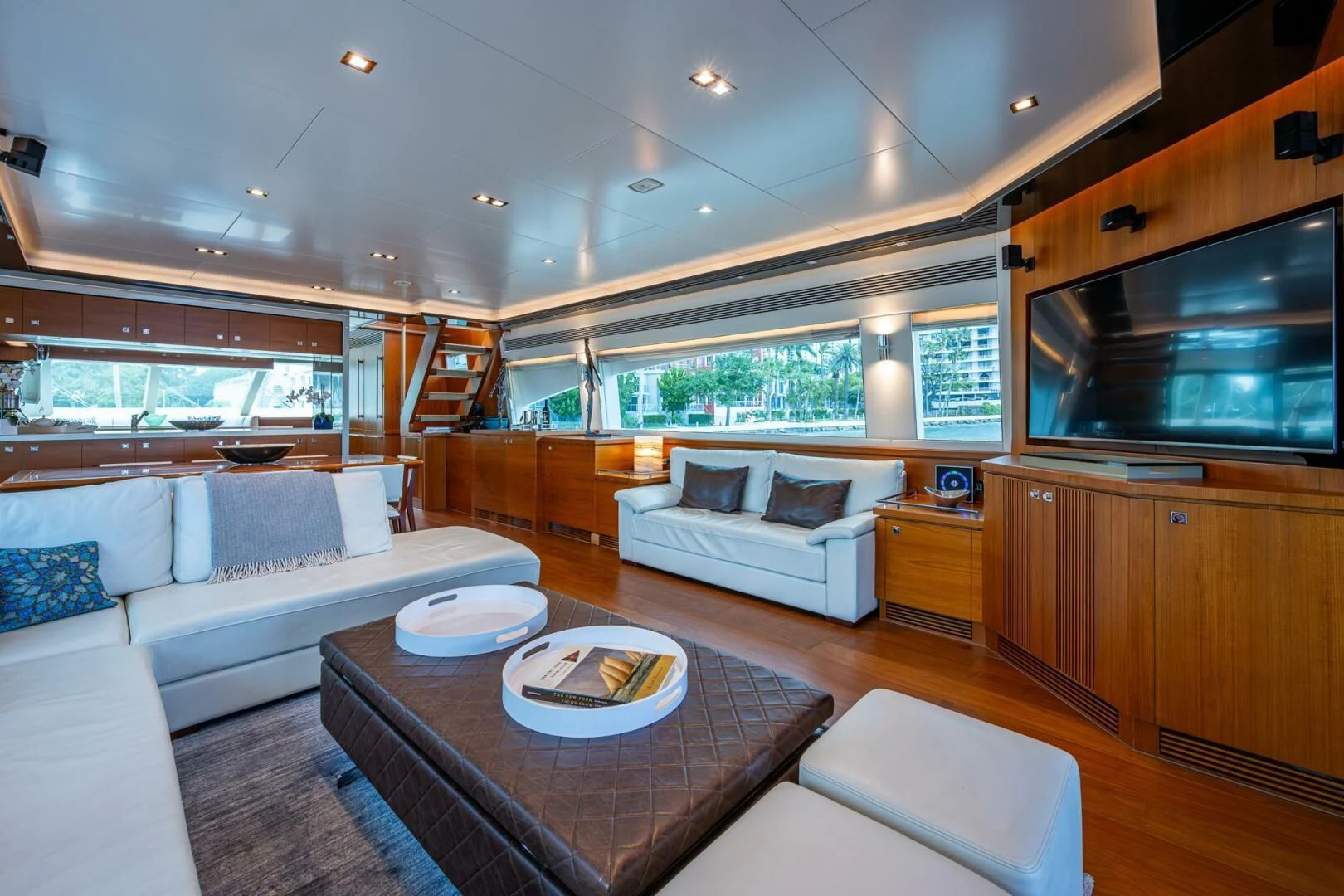 a living room with a couch and a table aboard MOIRA CINCO Yacht for Sale